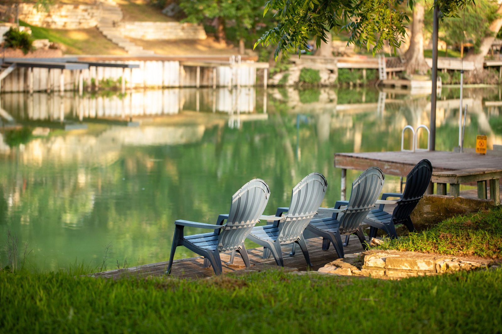 Private dock on Lake Placid with calm water and trees
