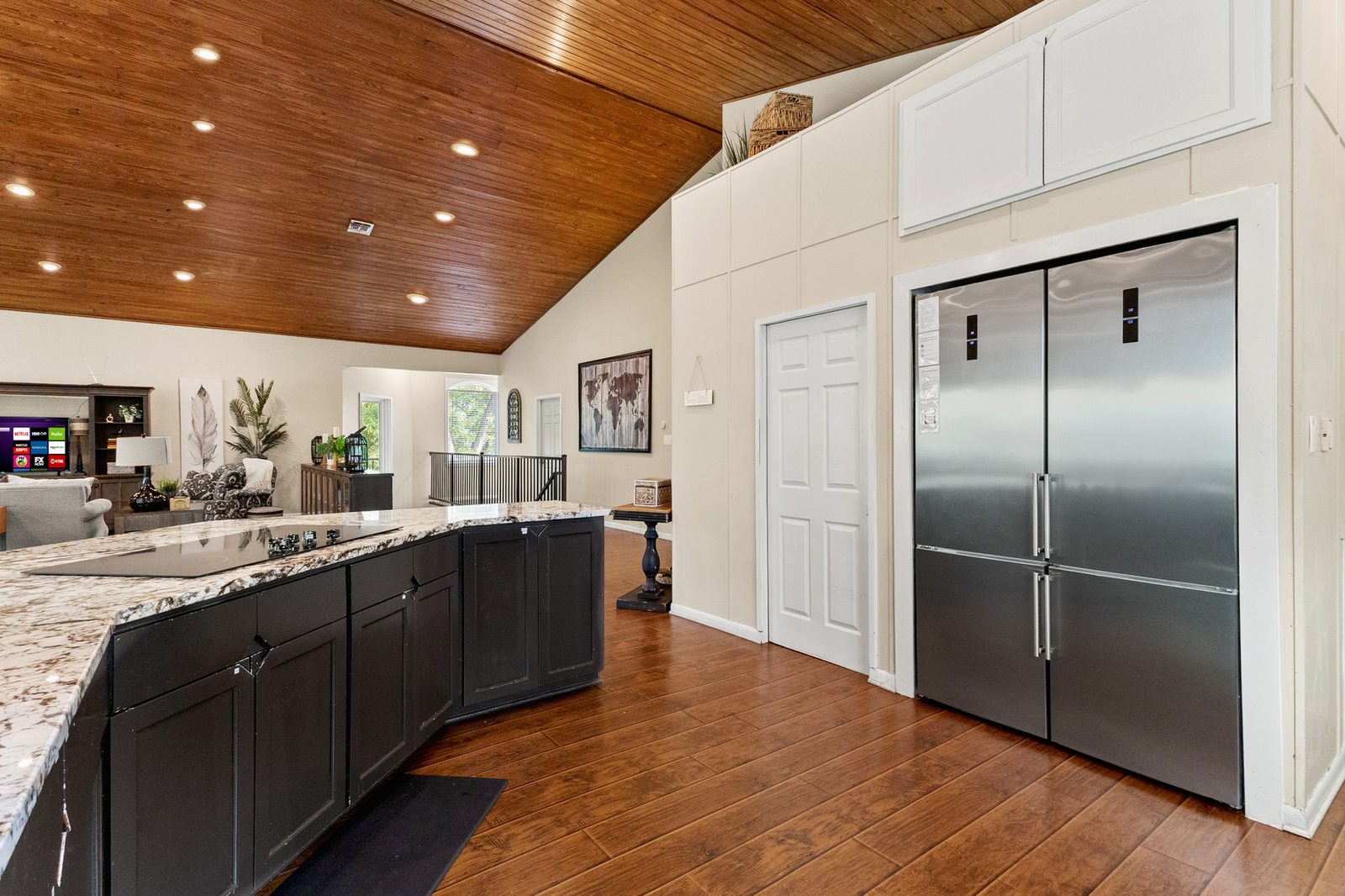 Full kitchen with large island and stainless appliances