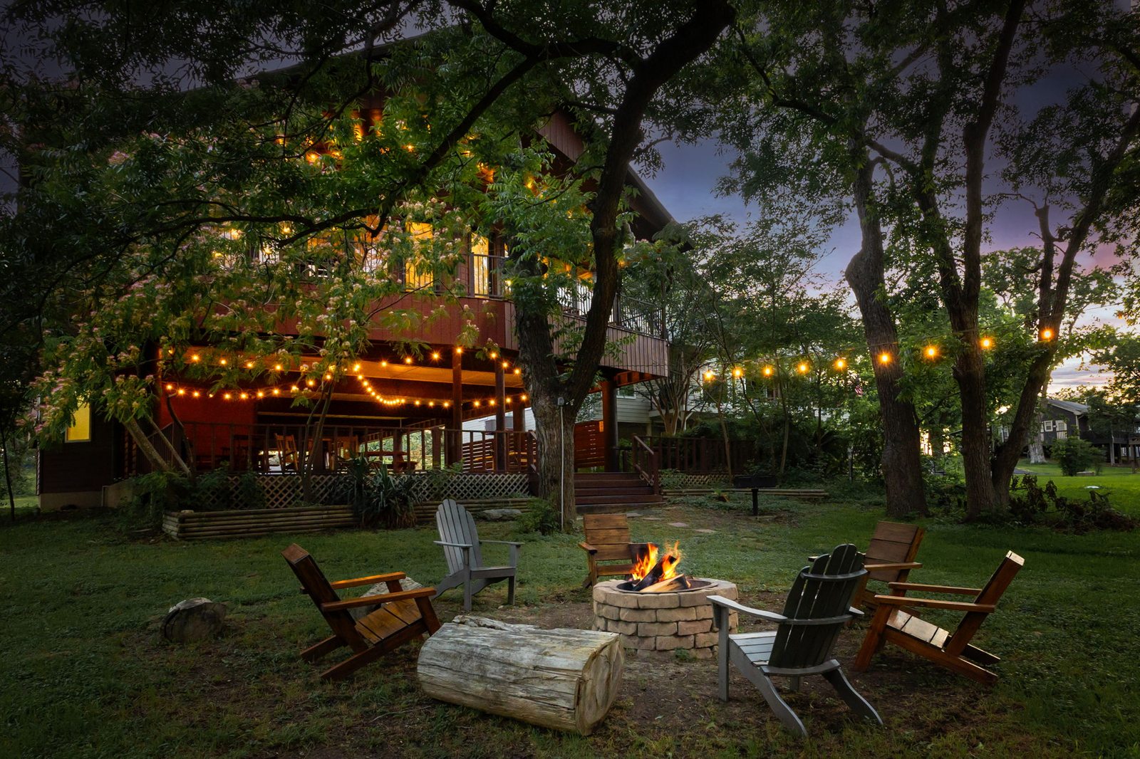 Firepit gathering area on the lakefront lawn