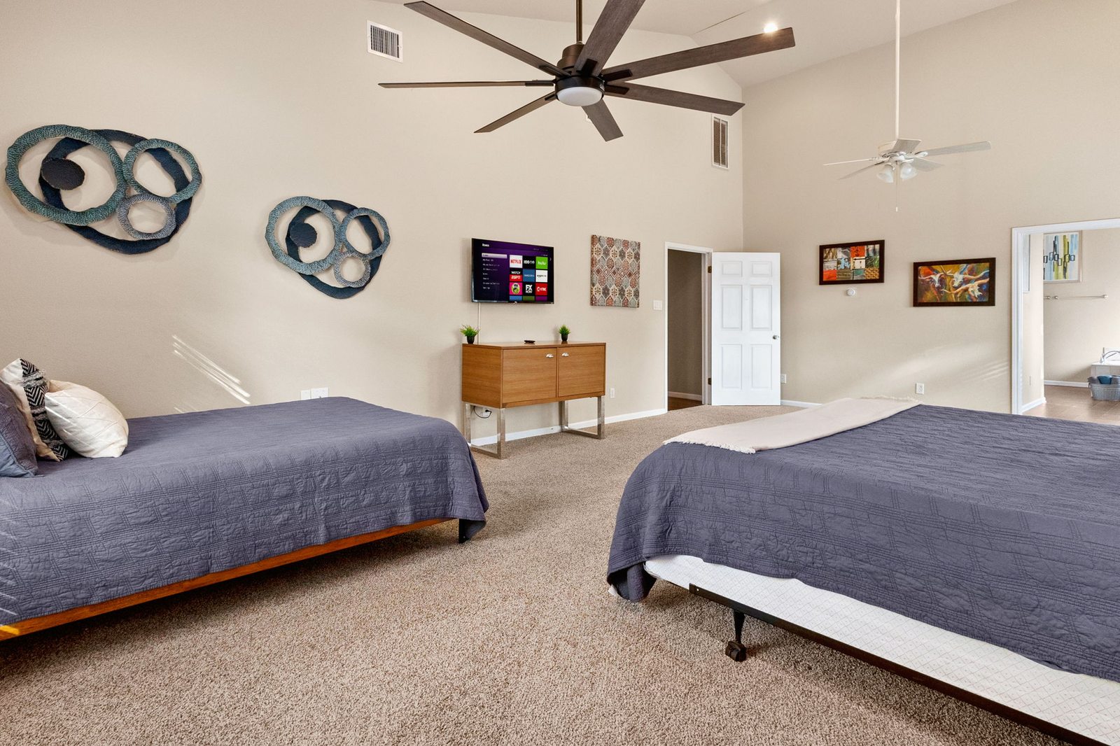 Primary bedroom sleeping and seating areas