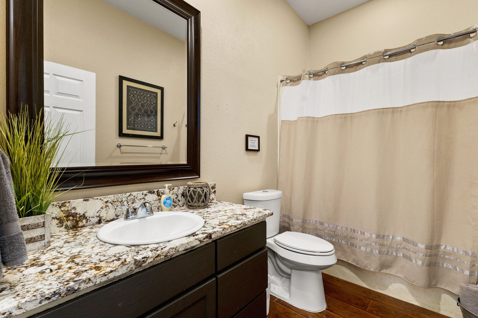 Full guest bathroom with tub and shower